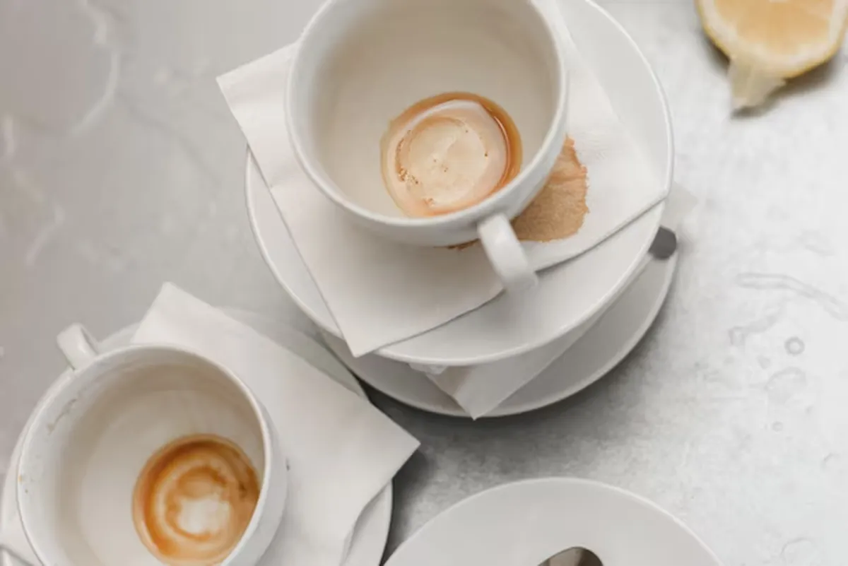 a stack of empty coffee cups