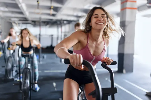 a woman on a stationary bike